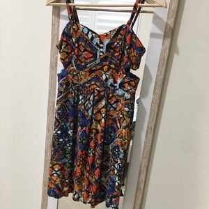 Short dress with cutouts on the sides.